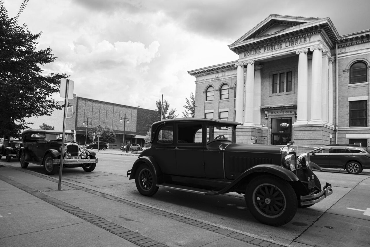 Classic cars parked in front of the Sound Conservatory. Photo by The Echo QC.
