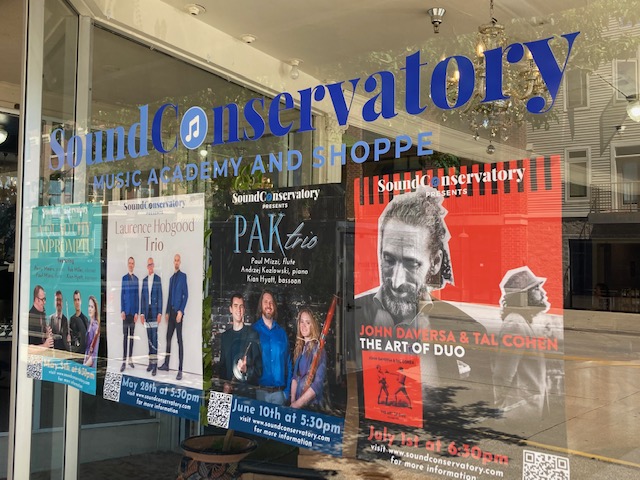 Sound Conservatory window with upcoming concerts listed.